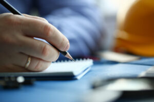 Right Hand Holding Black Pencil Writing